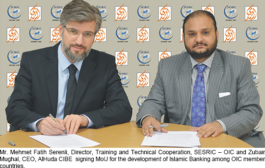Mr. Mehmet Fatih Serenli, Director, Training and Technical Cooperation, SESRIC – OIC and Zubair Mughal, CEO, AlHuda CIBE  signing MoU for the development of Islamic Banking among OIC member countries.